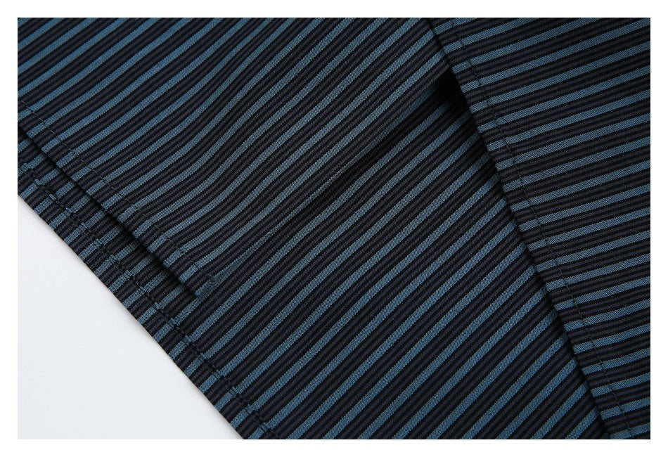 Close-up of the black and blue striped shirt fabric, seam, and hem stitching.