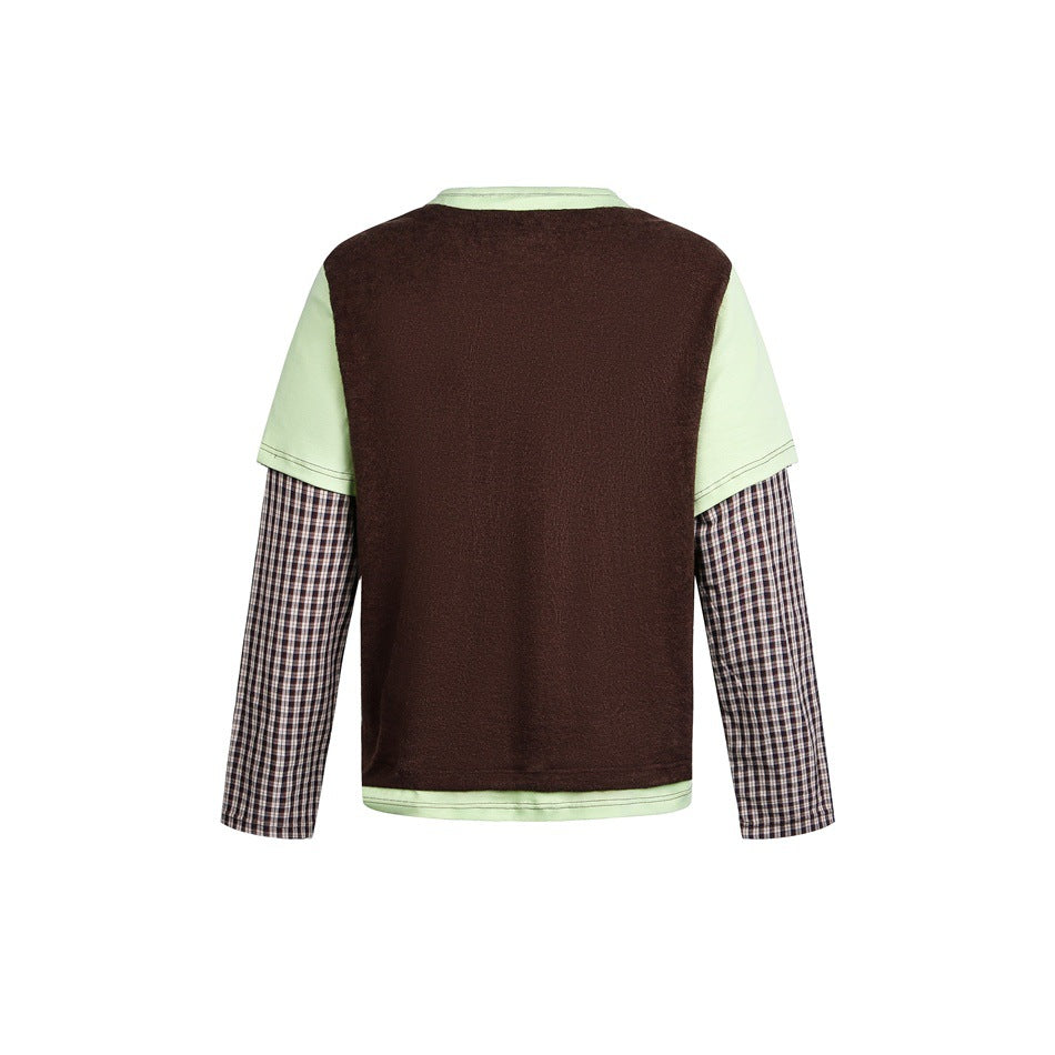 Back of a layered top with a dark brown body, pale green short sleeves, and brown plaid long sleeves.