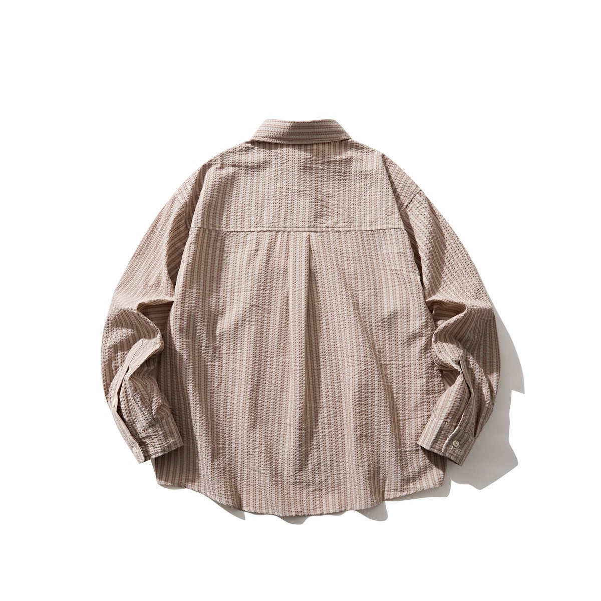 Back view of a beige-brown patterned long-sleeve button-up shirt with a yoke and curved hem.