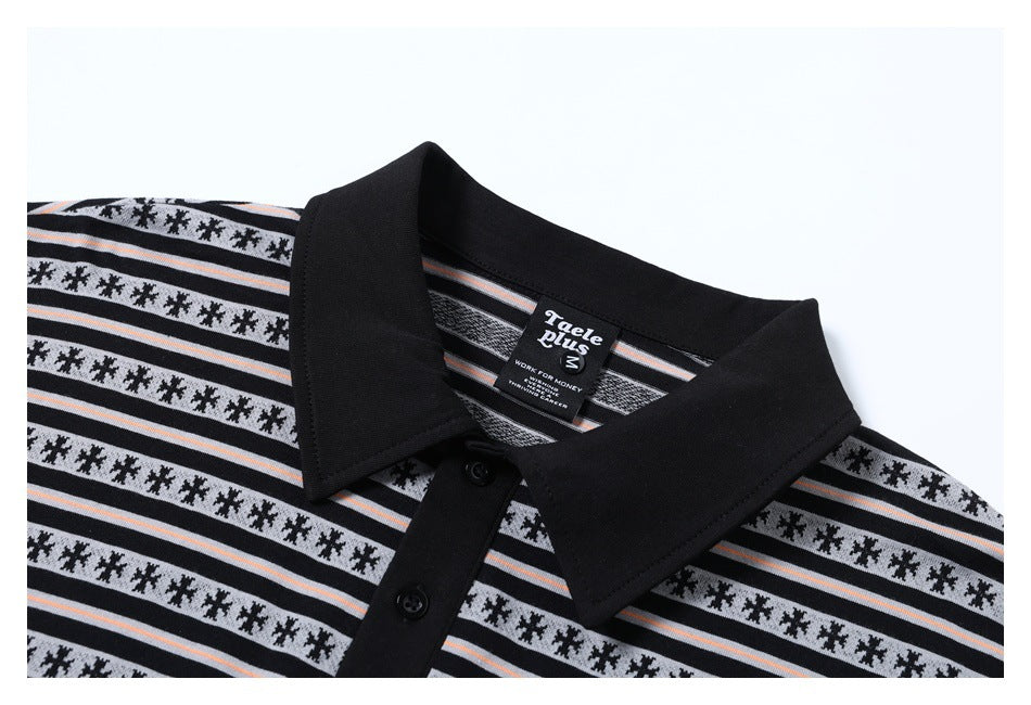 Close-up of a black polo collar and placket with buttons and black, white, and gray patterned stripes.