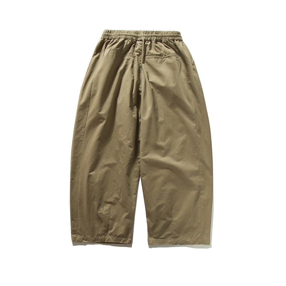 Khaki wide-leg pants back view showing elastic waistband, back pockets and leg seams, flat lay
