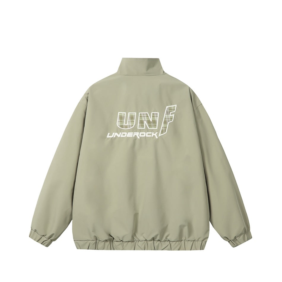 Back view of a light olive zip jacket with elasticated cuffs and hem and a large white graphic across the upper back.