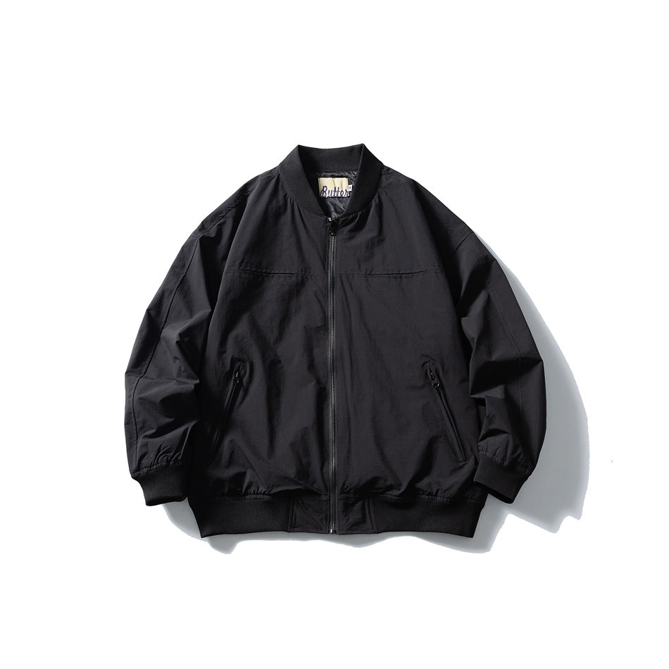 Black zip-front bomber jacket with ribbed collar, cuffs and hem, and slanted zip pockets, flat lay front view