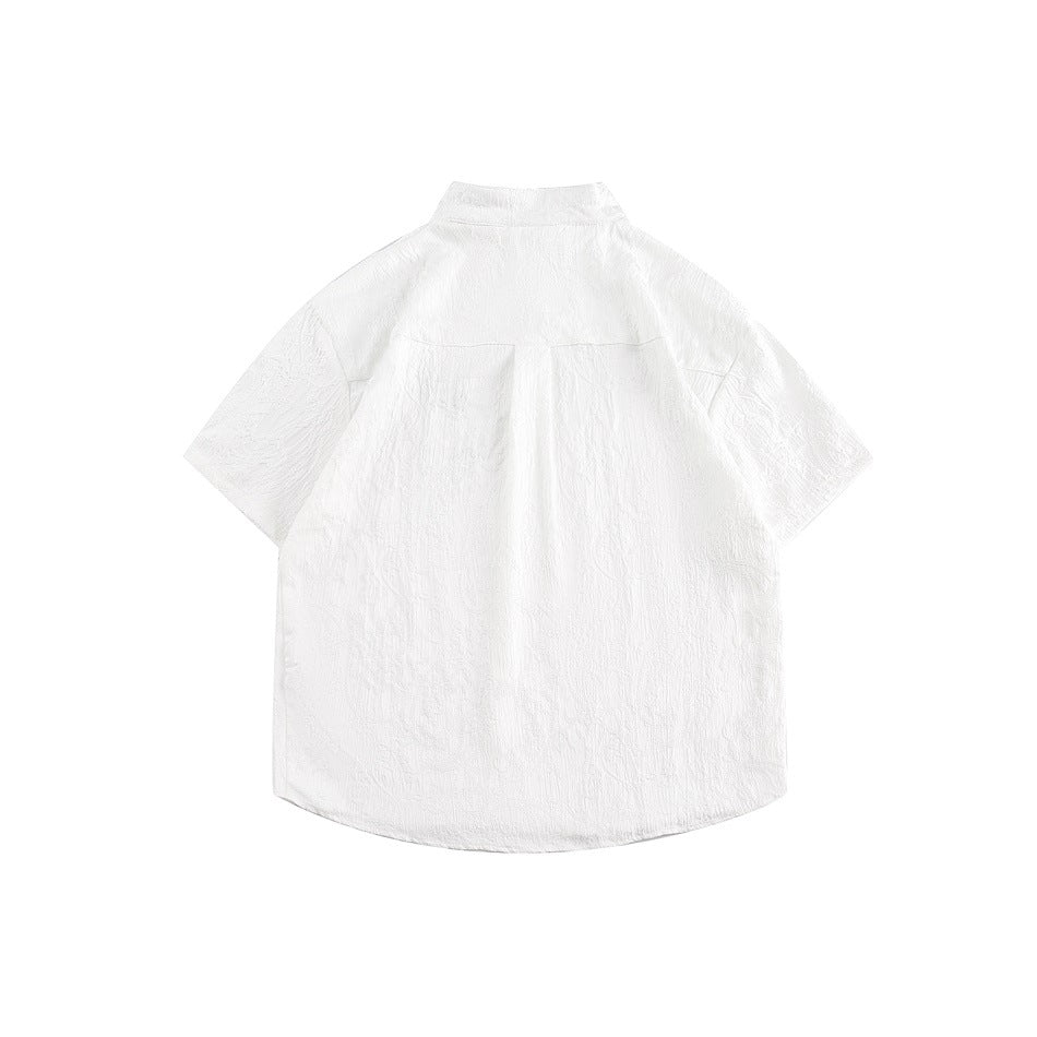 Back view of a white short-sleeve shirt with a stand collar, curved hem and subtle textured pattern.