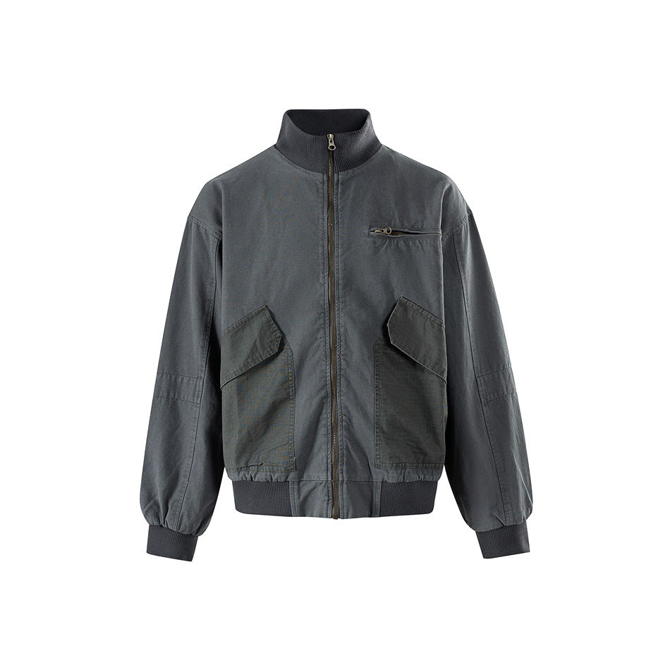 Gray zip-front jacket with ribbed stand collar, chest zip pocket and two contrast flap pockets, front view