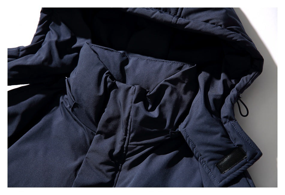 Close-up of the dark navy jacket hood interior and adjustable fastening details.
