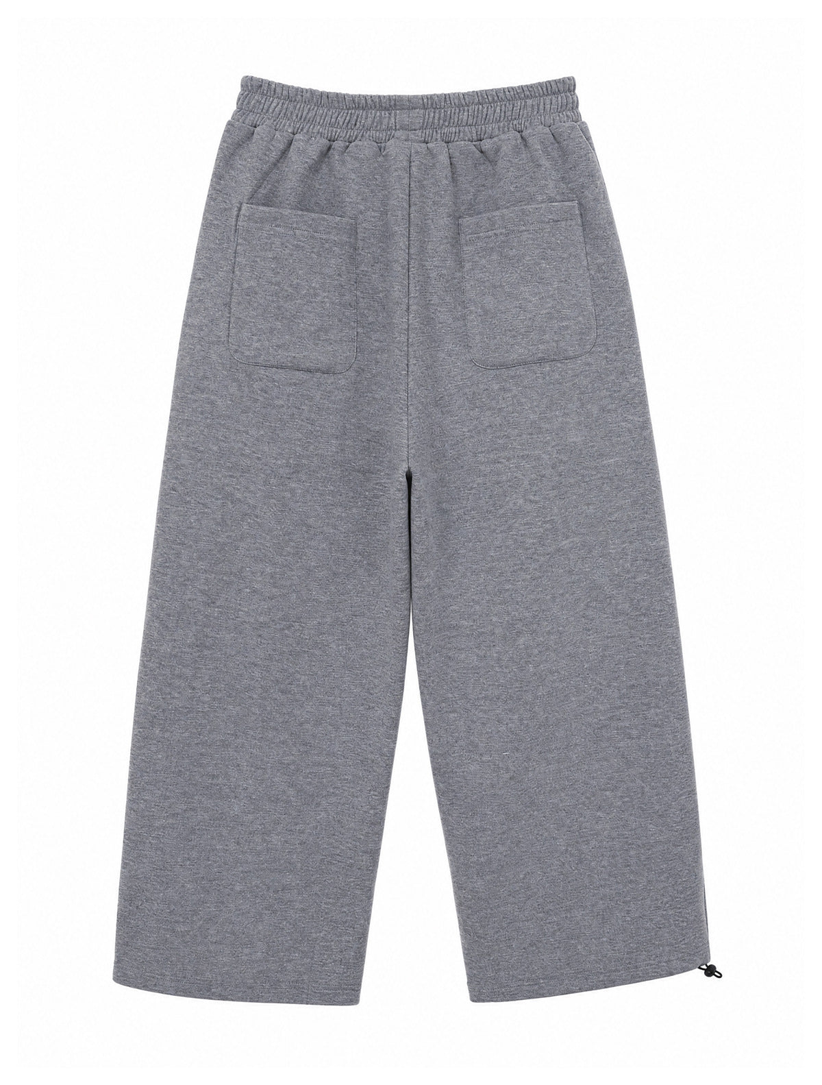 Back view of gray wide-leg pants with an elastic waistband, two patch pockets, and an adjustable ankle tie.