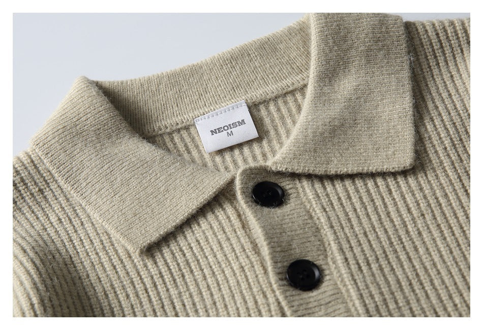 Close-up of the beige ribbed knit collar, black buttons, and sewn neck label reading NEOSM, size M.