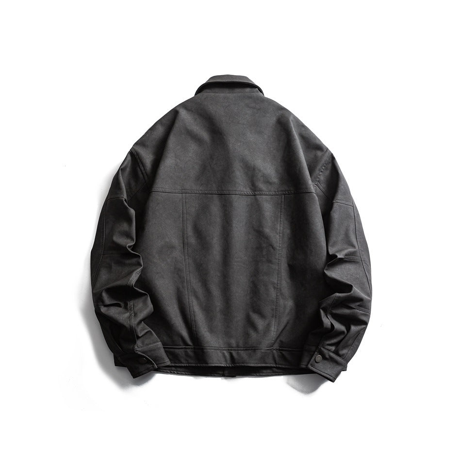 Back view of a charcoal jacket laid flat, with a collar, panel seams, and buttoned cuffs.