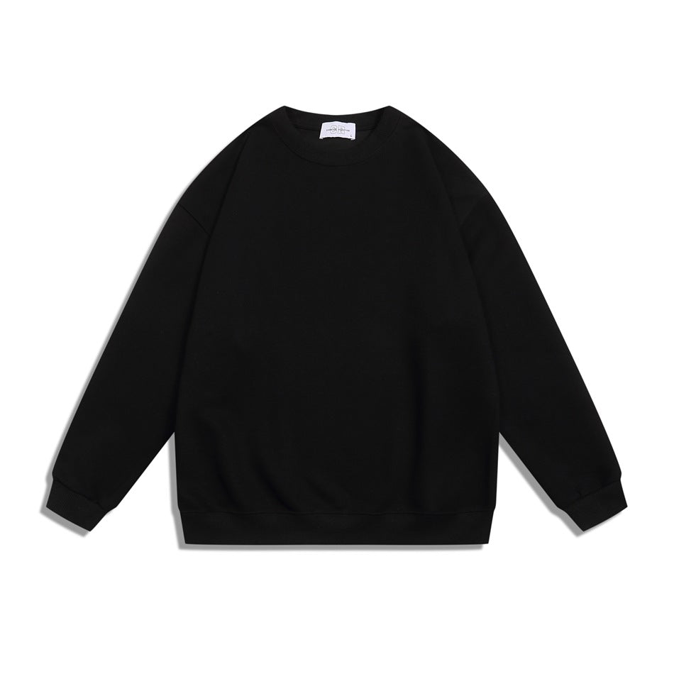Black crew neck sweatshirt flat lay, front view, with ribbed collar, cuffs and hem