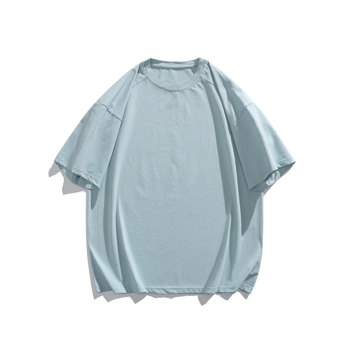 Light blue short-sleeve crew neck T-shirt with dropped shoulders, flat lay front view