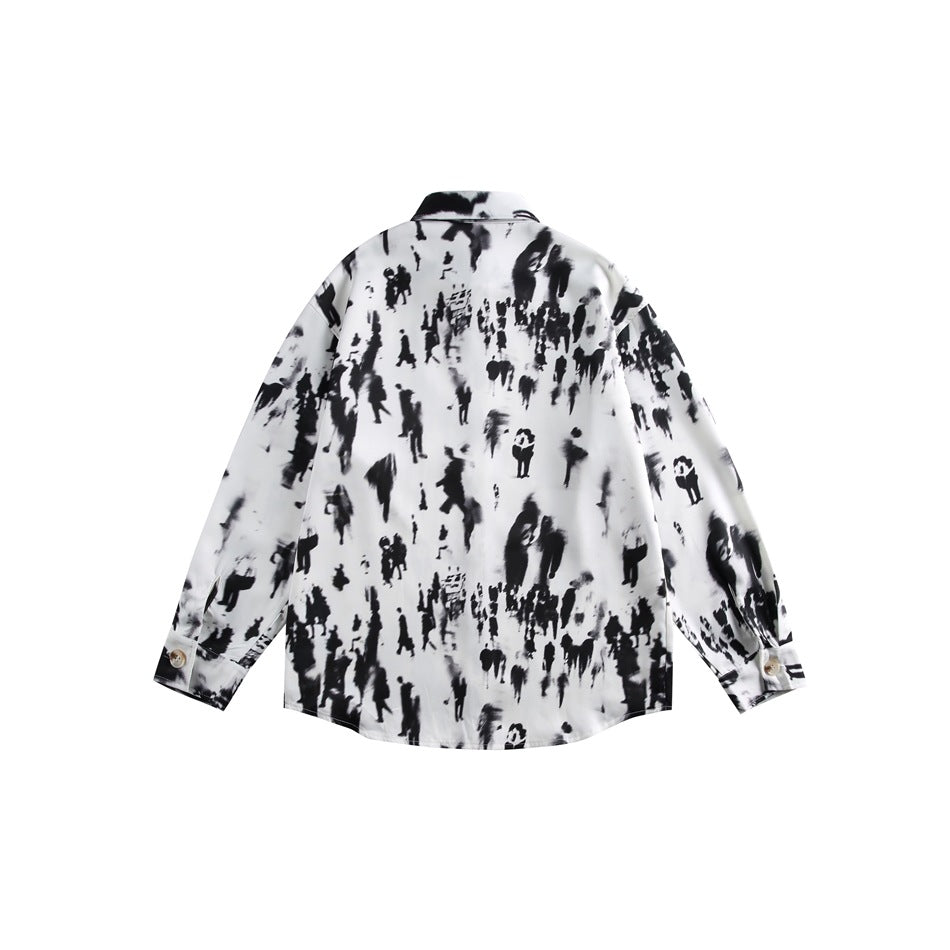 Back view of a white long-sleeve button-up shirt with an allover black blurred-figure print.
