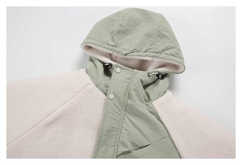Close front view of a sage-green hooded jacket with cream fleece lining, snap buttons, and drawcords.