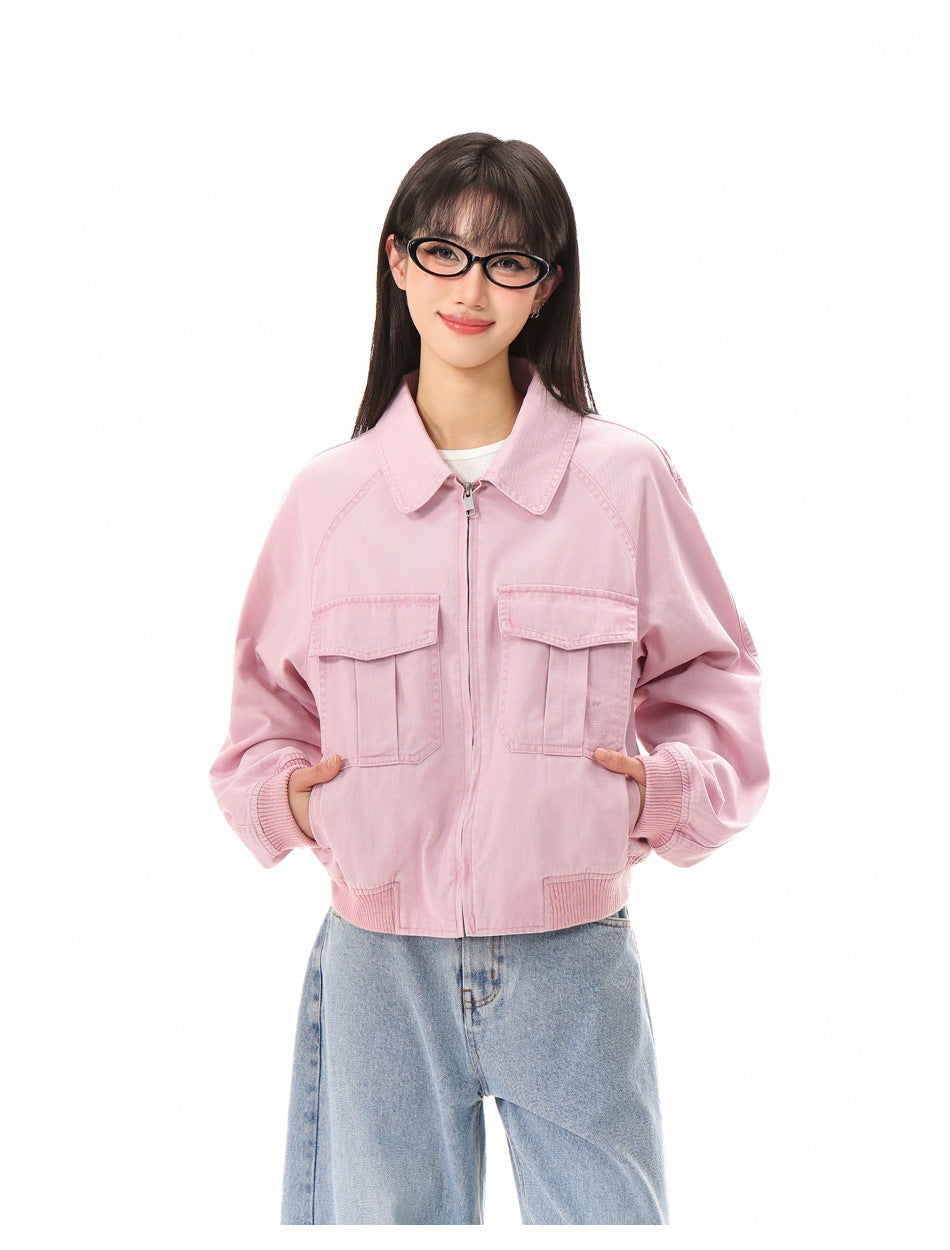 Model wearing a light pink zip-front jacket with a pointed collar, roomy sleeves, and two flap chest pockets.