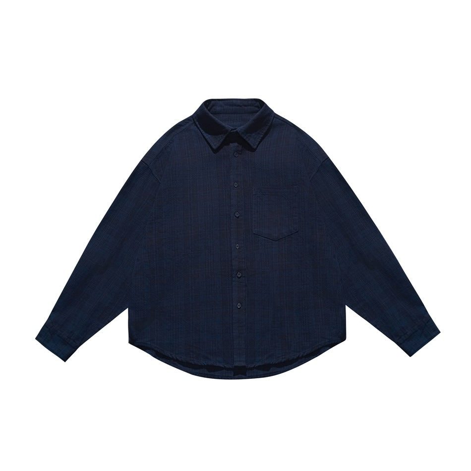 Navy long-sleeve button-up shirt with chest pocket, flat lay front view on a white background