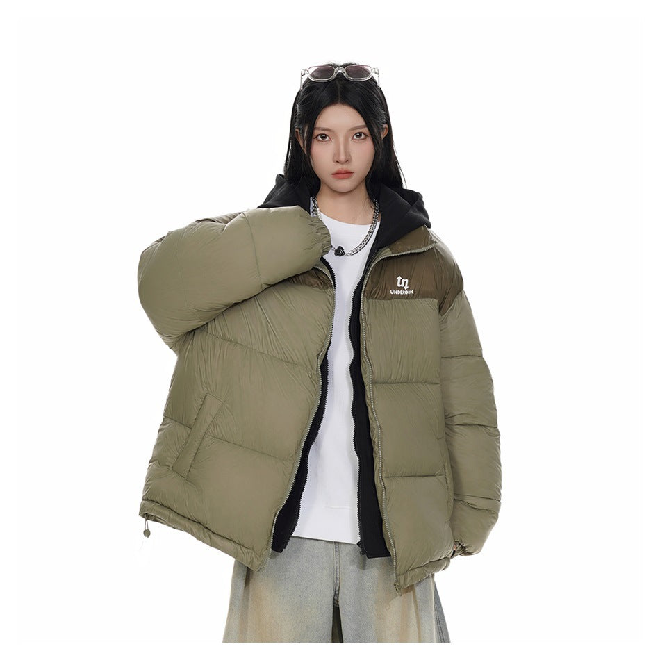 Model wearing the light army green puffer jacket open, showing the black inner layer over a white top and chain necklace