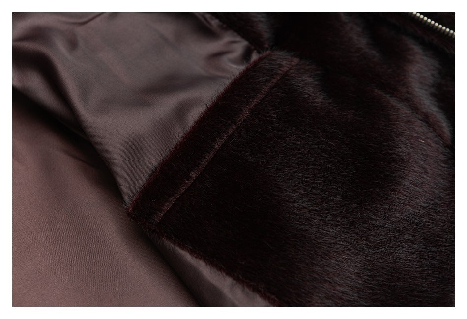 Close-up showing the smooth brown lining beside the plush outer fabric and a section of zipper.