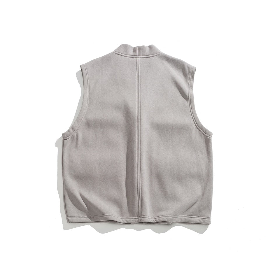 Back view of gray sleeveless vest with a vertical center seam and a high rounded collar