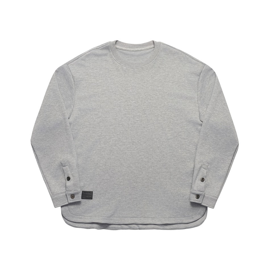 Heather gray long-sleeve crew-neck top, front flat lay, with button cuffs, curved hem and small dark label patch