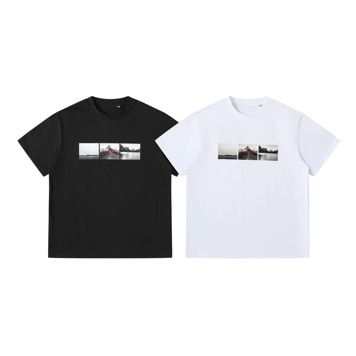 Black and white crew-neck short-sleeve T-shirts shown from the front, each with a small monochrome landscape print.