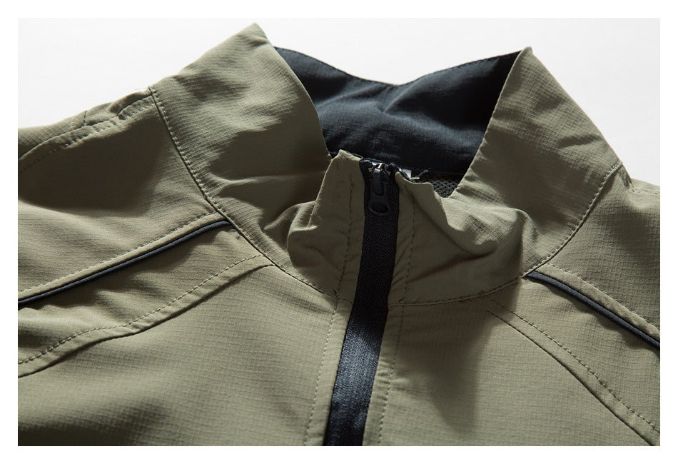 Close-up of an olive khaki jacket collar with a black front zipper and dark lining.