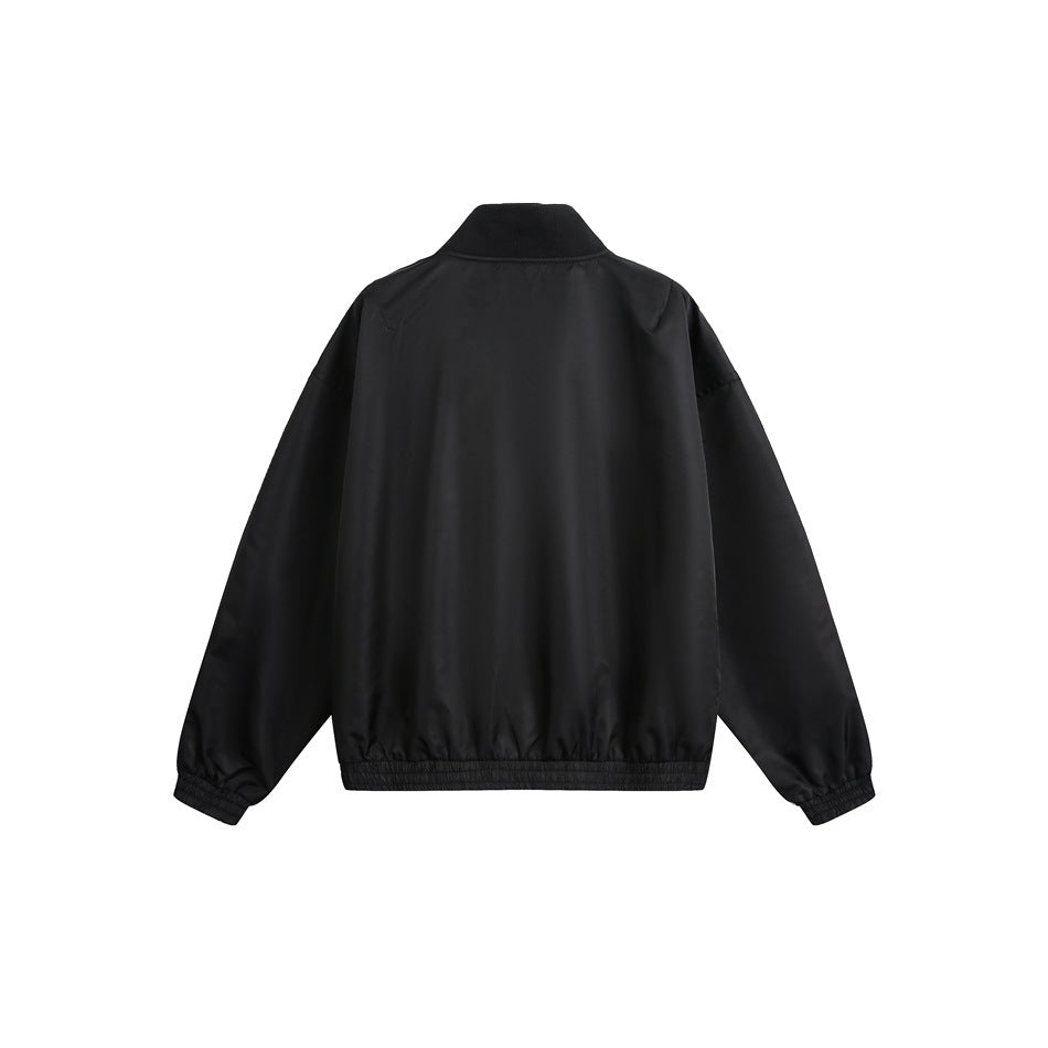 Back view of a black jacket with a stand collar and elastic cuffs and hem.