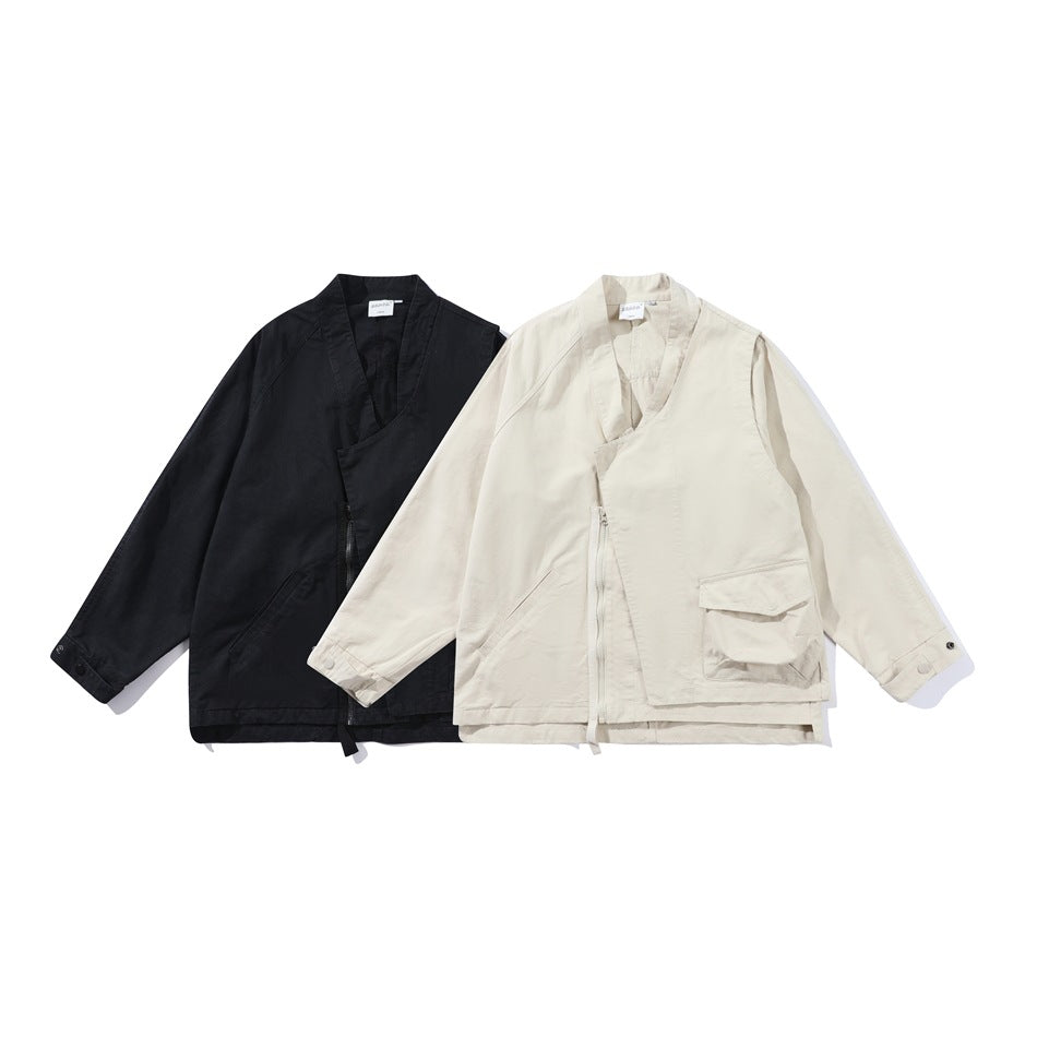 Front view of two utility jackets, one black and one off-white, displayed side by side.