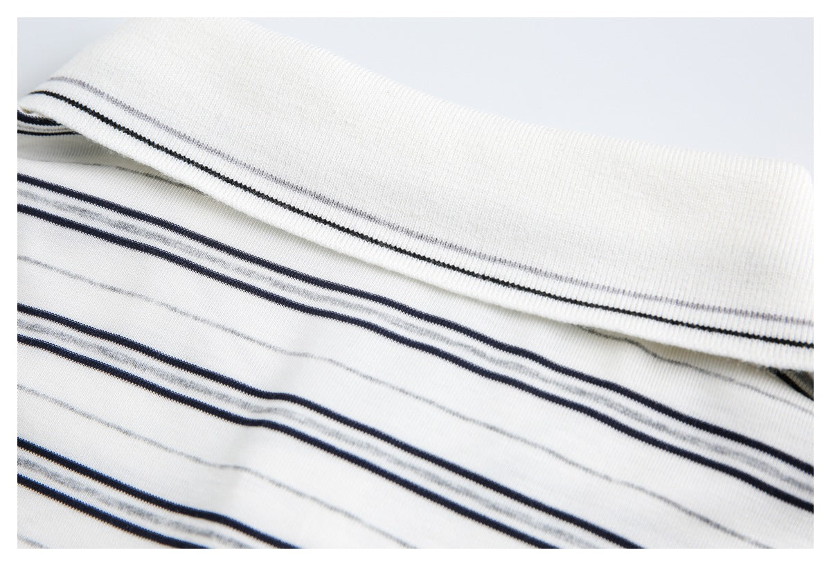 Close-up of a white striped garment collar and neckline.