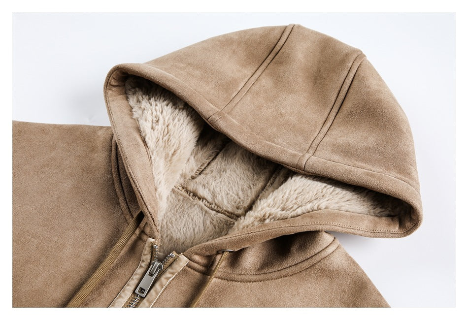 Close-up of a tan coat hood showing its plush cream lining, stitched seams, and front zipper.