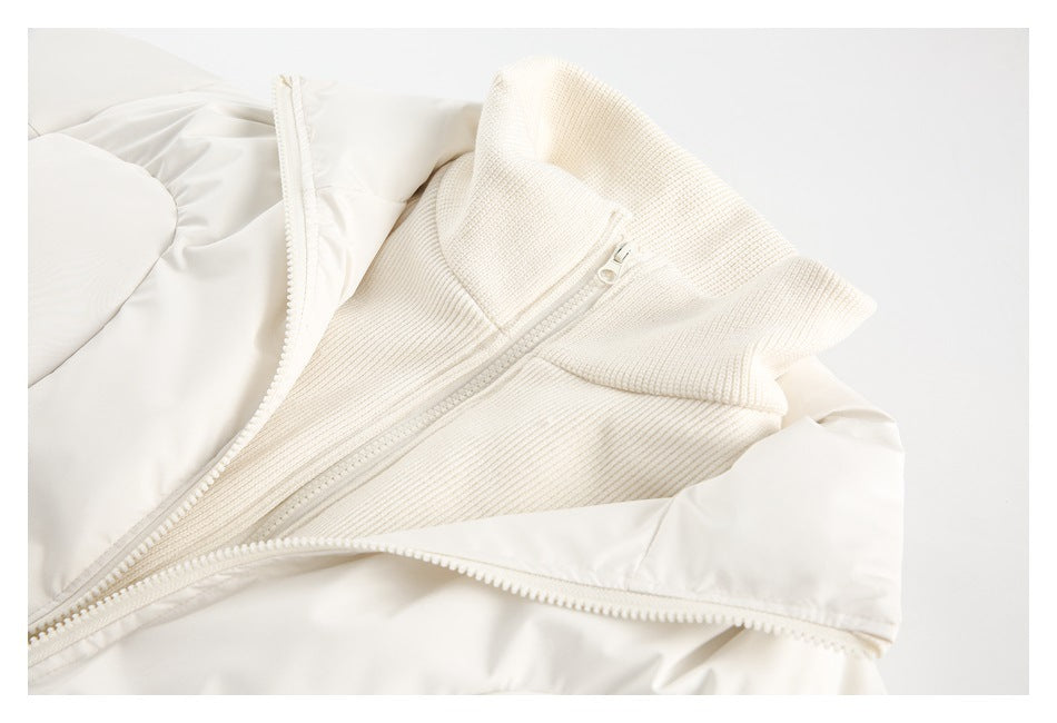 Close-up of the ivory jacket opened to reveal a textured knit inner collar and zipper.