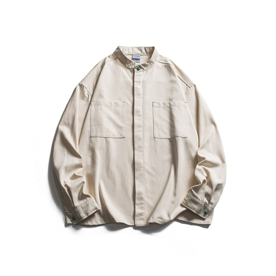 Beige stand-collar long-sleeve shirt, front flat lay with two chest patch pockets and green snap buttons
