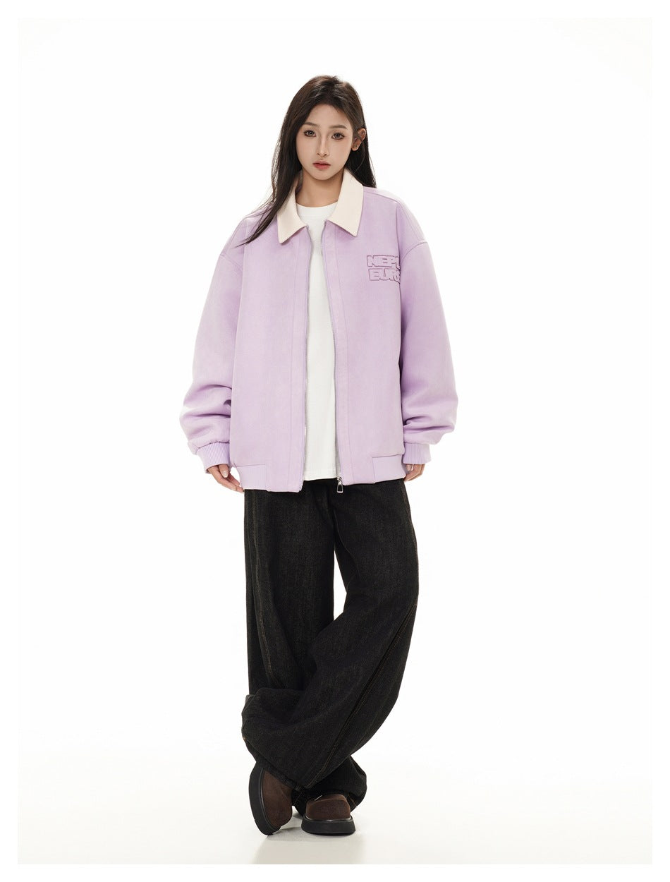 Full-length front view of a model wearing a lilac jacket with a cream collar, white shirt, and wide black trousers.
