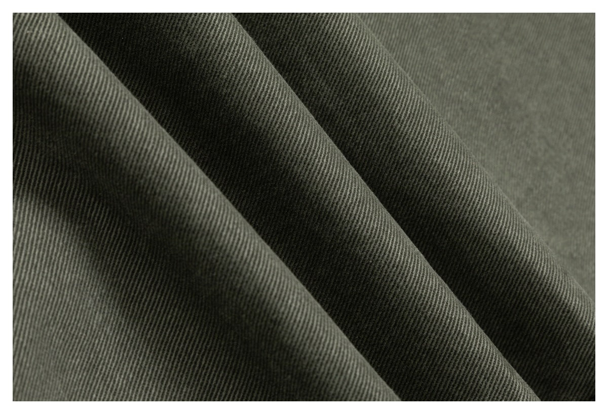 Close-up of dark charcoal-gray ribbed fabric draped in soft folds.