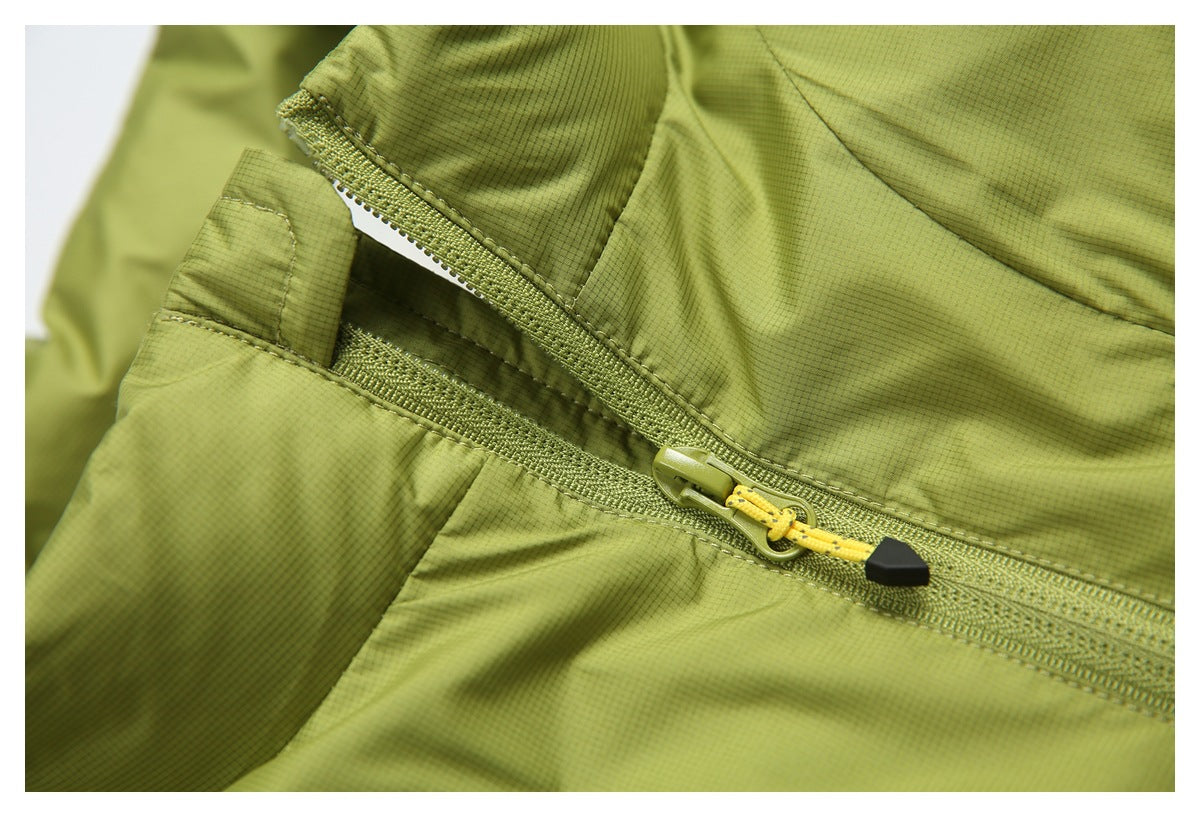 Close-up of a lime-green zippered pocket with a yellow cord pull and black end piece.