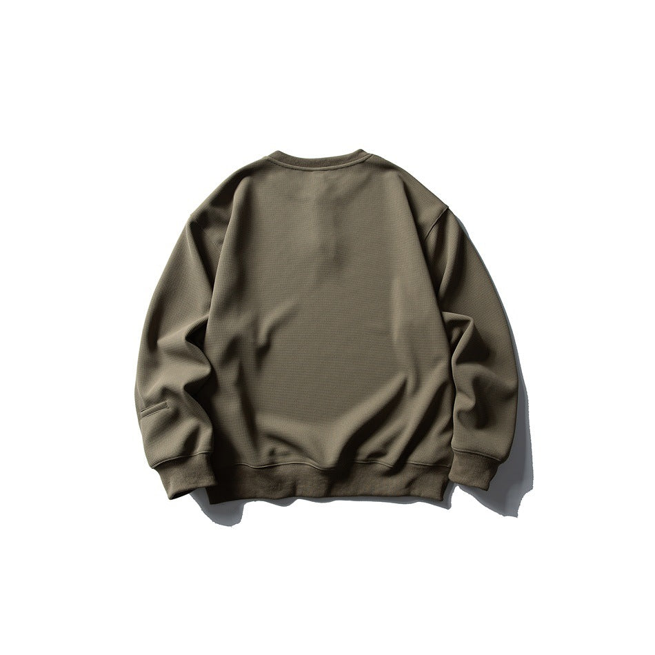 Back view of an olive long-sleeve sweatshirt with a plain back and ribbed cuffs and hem.
