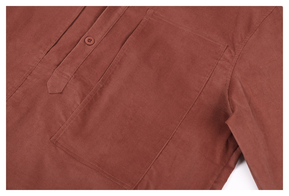 Close-up of a rust-brown shirt front with a buttoned placket and large patch pocket.