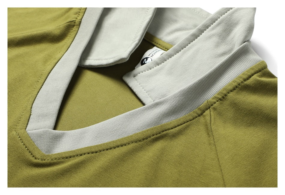 Close-up of an olive-green shirt neckline with a light gray collar and contrasting inner placket.