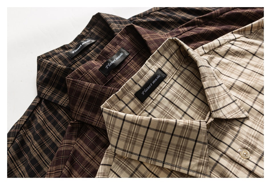 Close-up of three plaid button-up shirts in dark brown, burgundy, and beige, with their collars and sewn labels visible.