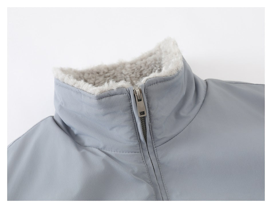Close-up of the jacket's high collar, plush cream lining, and front zipper.