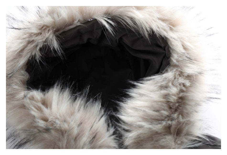 Close-up of the jacket hood's thick gray-beige fur trim and dark lining.