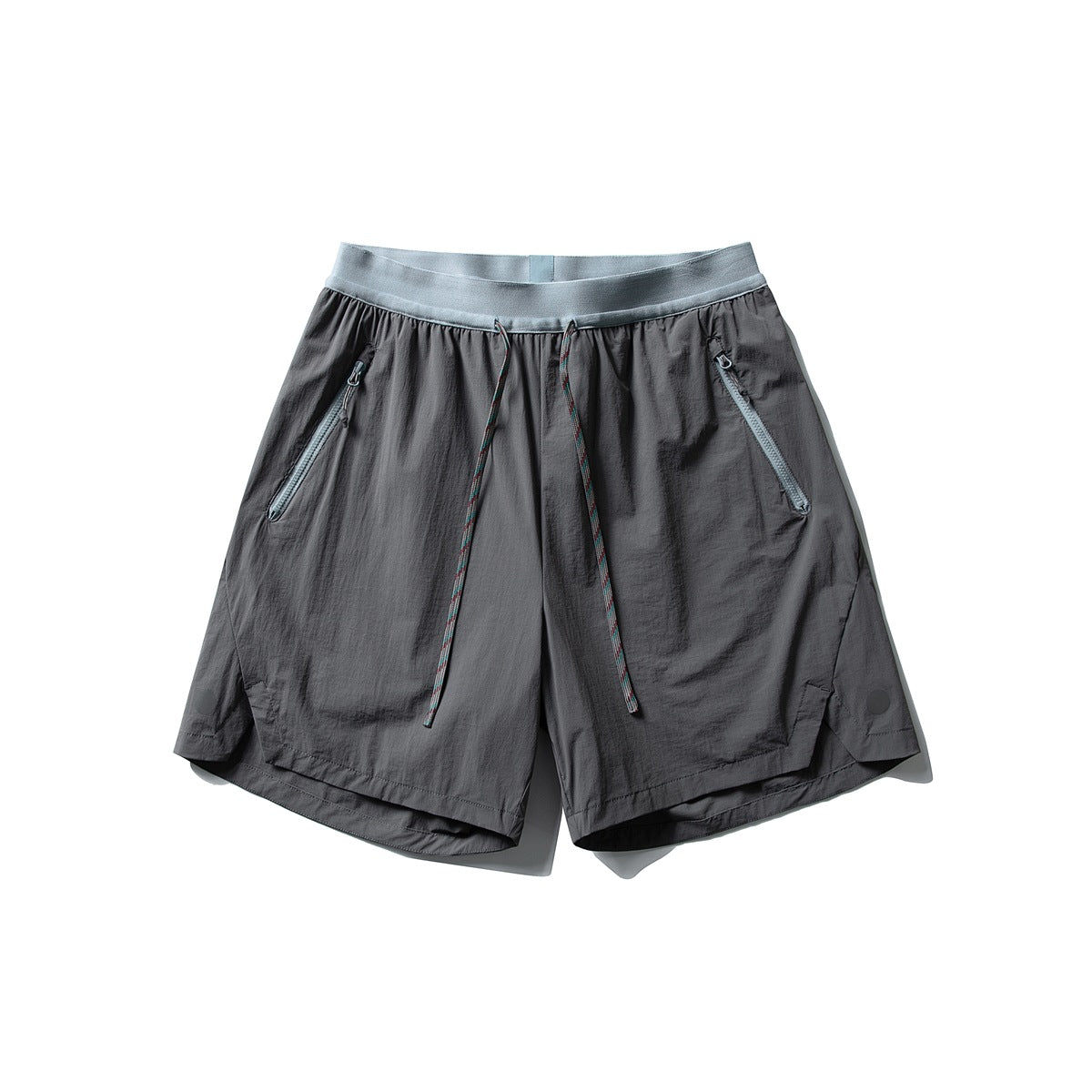 Dark gray drawstring shorts with light blue-gray waistband and zipper pockets, flat lay