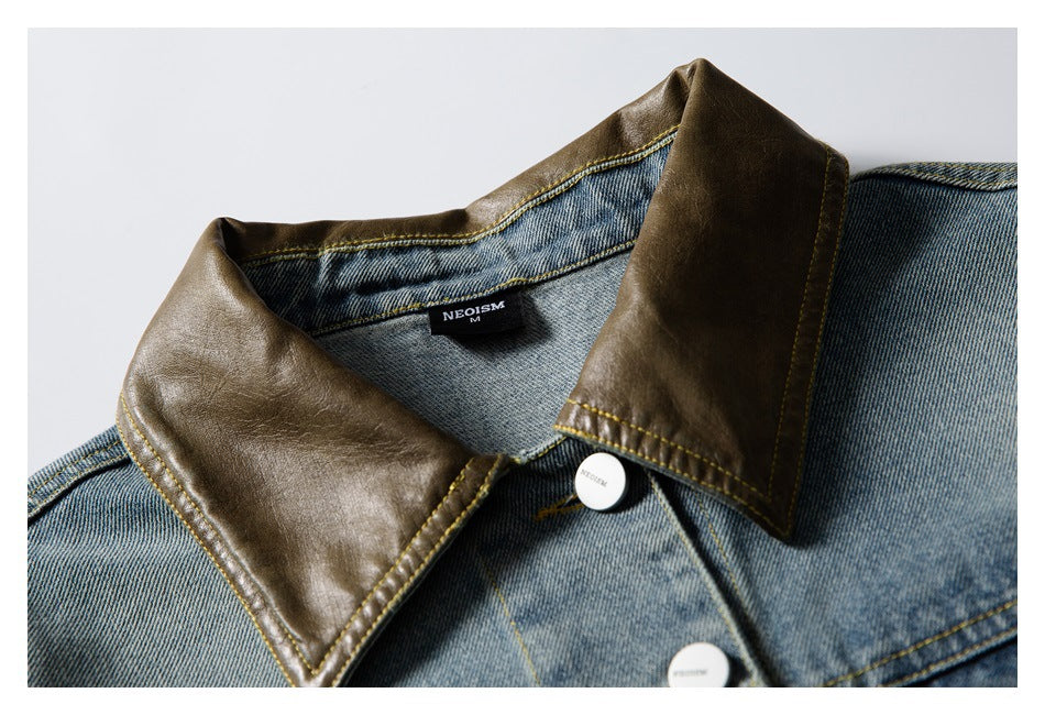 Close-up of the jacket's brown collar, faded blue denim, yellow stitching, and front buttons.