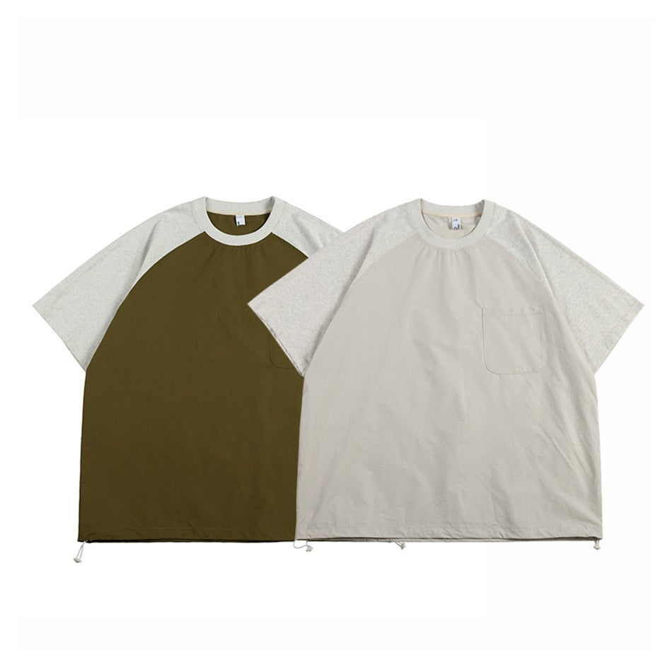 Two front-view raglan T-shirts with chest pockets: one olive with heathered sleeves, the other light beige with heathered
