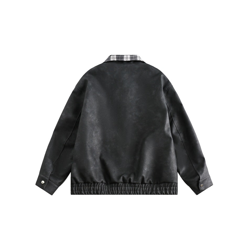 Back view of a charcoal jacket with a plaid collar, button cuffs, and gathered hem.
