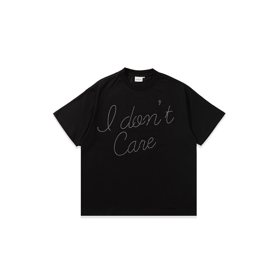 Black short-sleeve crew-neck T-shirt with script 'I don't Care' rhinestone-dot lettering on the chest, flat front view