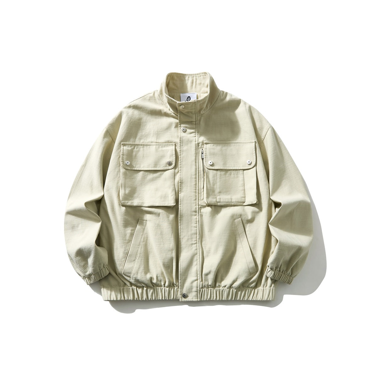 Off-white stand-collar jacket with two large flap chest pockets, snap closures and elastic cuffs and hem, flat lay front view