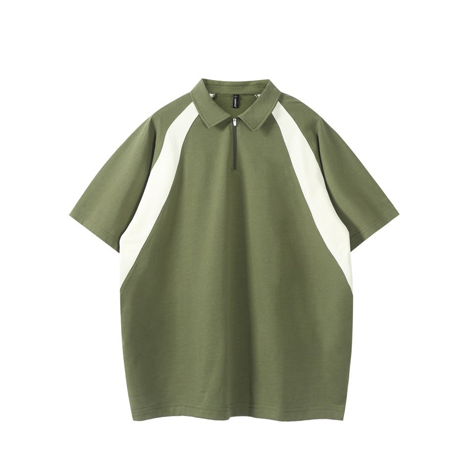 Olive green short-sleeve quarter-zip polo with off-white curved raglan panels, front view on white background