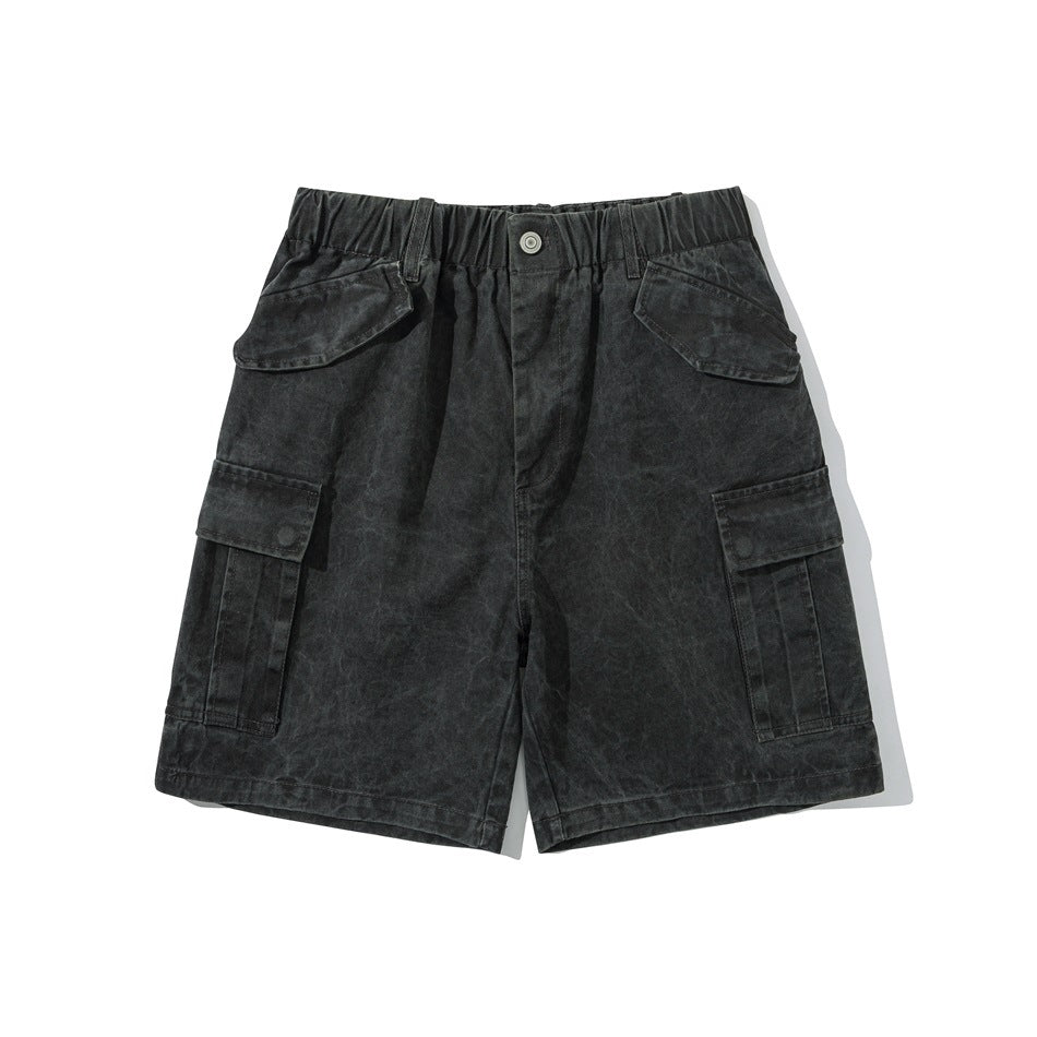 Dark gray washed cargo shorts flat lay with elastic waistband, flap pockets and side cargo pockets