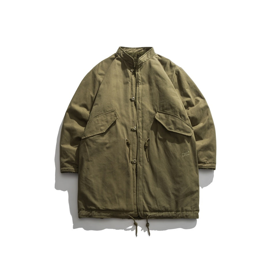 Olive green mid-length stand-collar jacket flat lay, front with buttons, flap pockets and drawcord hem