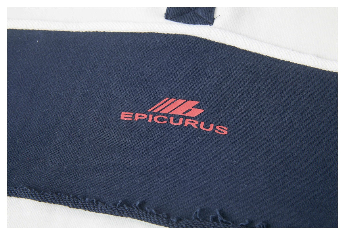 Close-up of a red EPICURLUS logo printed on a navy stripe of a white-and-navy shirt.